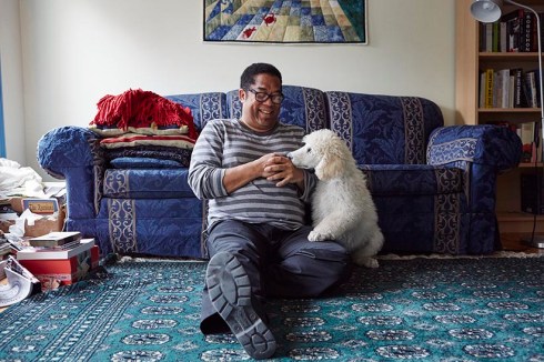 Andre Alexis in his home. (Photograph by Jaime Hogge)